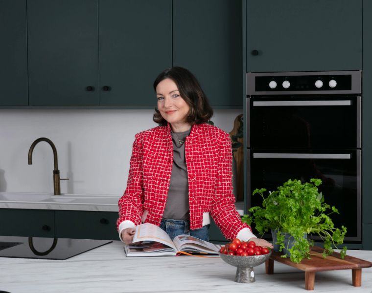 Dee Coleman in her Forest Green Kitchen