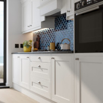 Close up of a run of Hampton Cotton White cabinets, shaker door with dark worktop