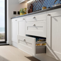 Open drawer in a Hampton Cotton White kitchen with dark worktop