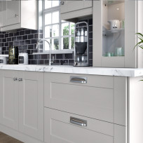 Shaker Light Grey Kitchen closeup of handles, worktop and glass unit
