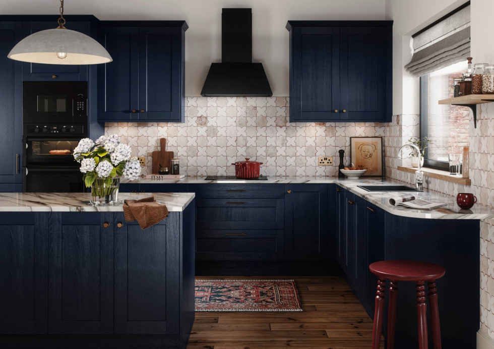 View of the Mirano Ink blue kitchen from the front, with kitchen island, marble worktop, brass handles