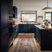 Ink blue medium rail shaker kitchen door with a subtle woodgrain texture.
