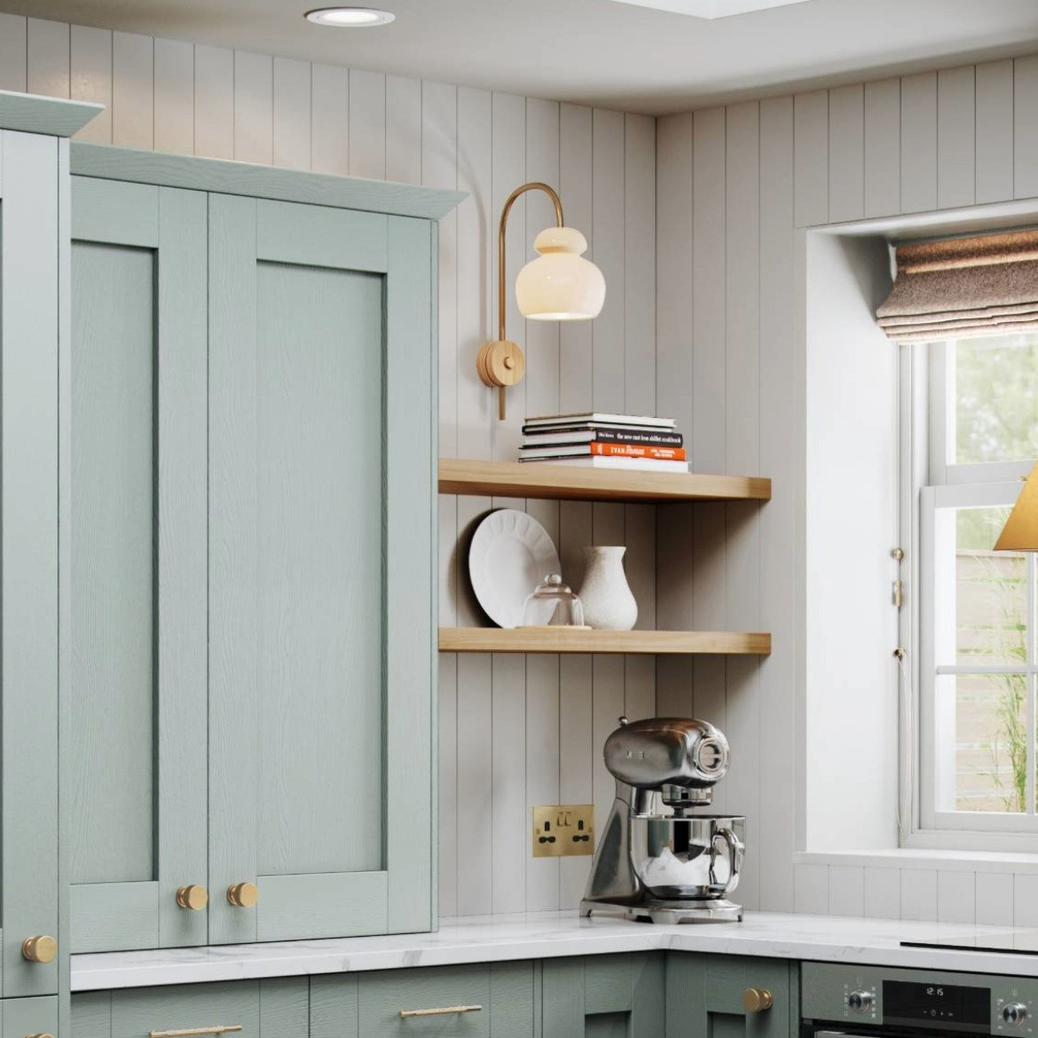 A close up of the Mirano Sage kitchen highlighting woodgrain effect, brass handles and India White worktop