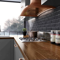 View of the Elica Sweet Copper hood from below in a Modica Dust Grey kitchen