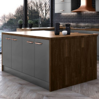 Close up of a kitchen island in the Modica Dust Grey with a waterfall effect worktop. The countertop is plank nogal.