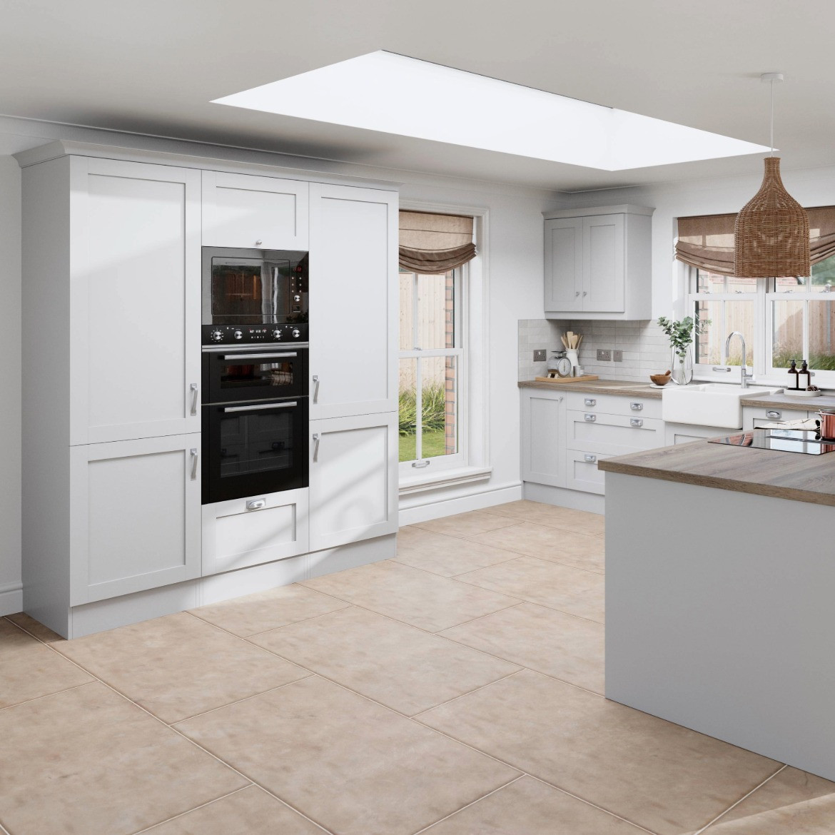 Shaker Light Grey kitchen, including tall units with double ovens and a peninsula with oak worktop