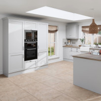 Shaker Light Grey kitchen, including tall units with double ovens and a peninsula with oak worktop